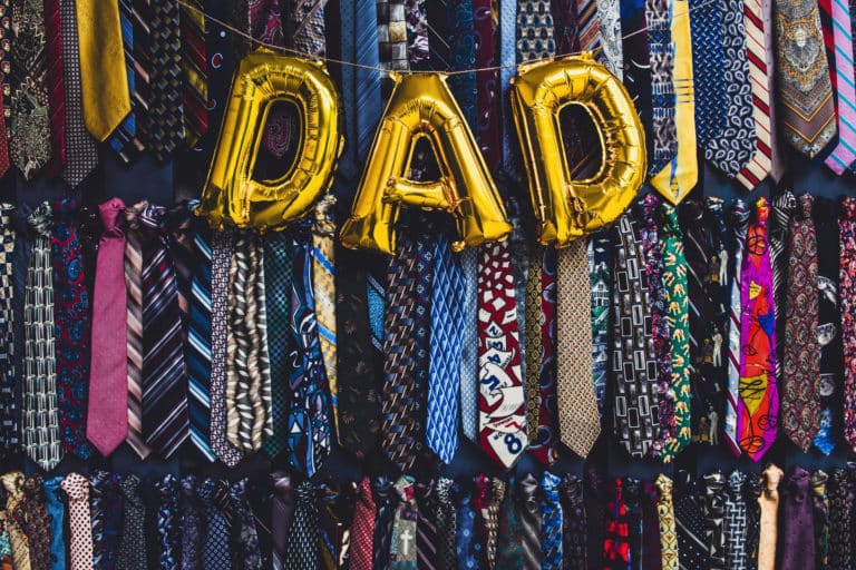 Dad sign with festive decorations and ties